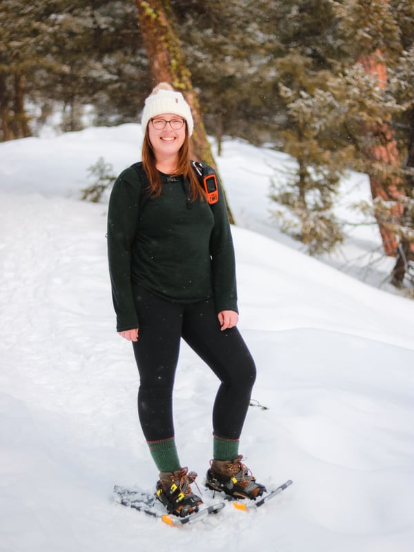 Woman snowshoeing at Telemark Nordic Club in Kelowna.