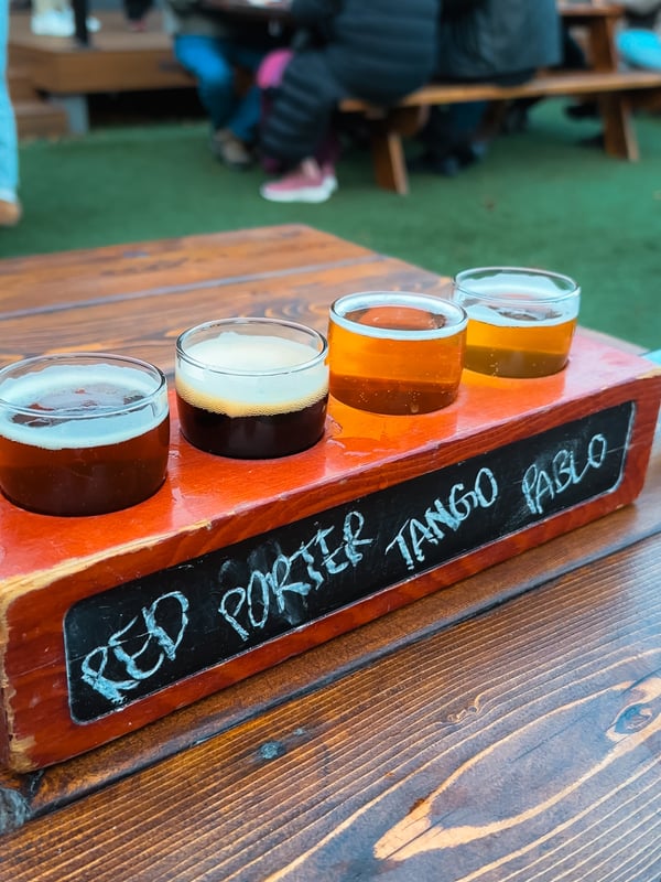 Four sample sized beers.