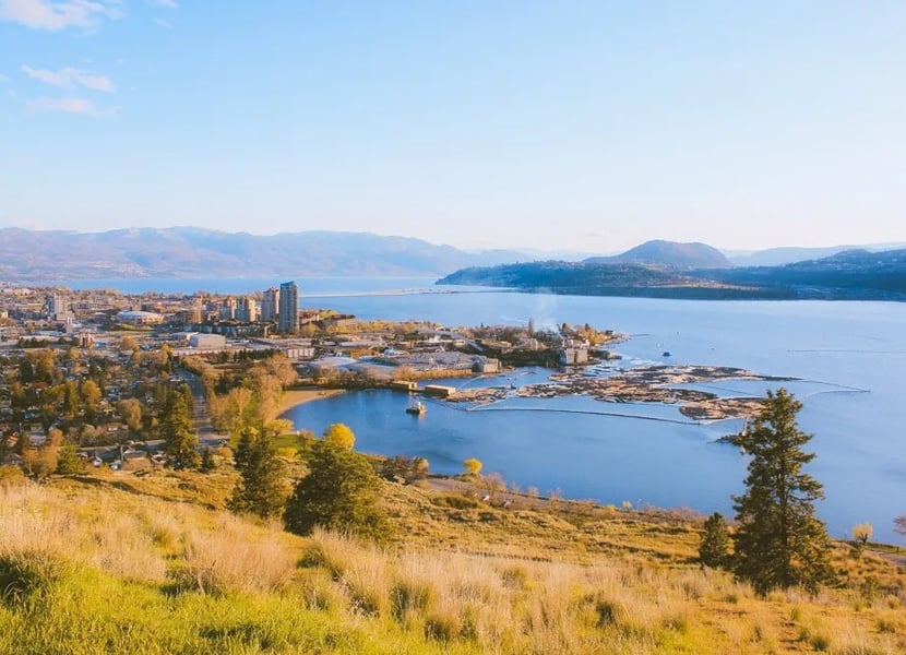 View of downtown Kelowna and Okanagan Lake from the trailhead of Paul's Tomb trail on Knox Mountain.