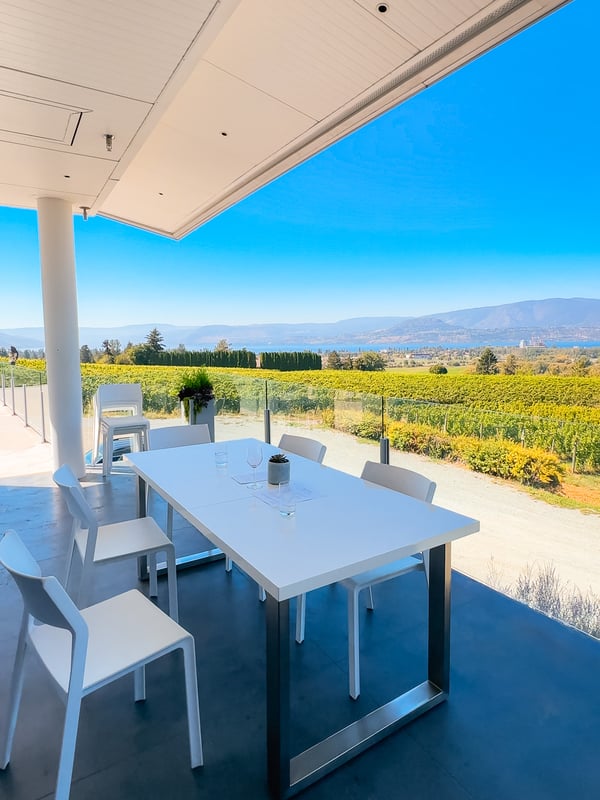 The outdoor tasting table at Tantalus Vineyards overlooking Kelowna and Okanagan lake.