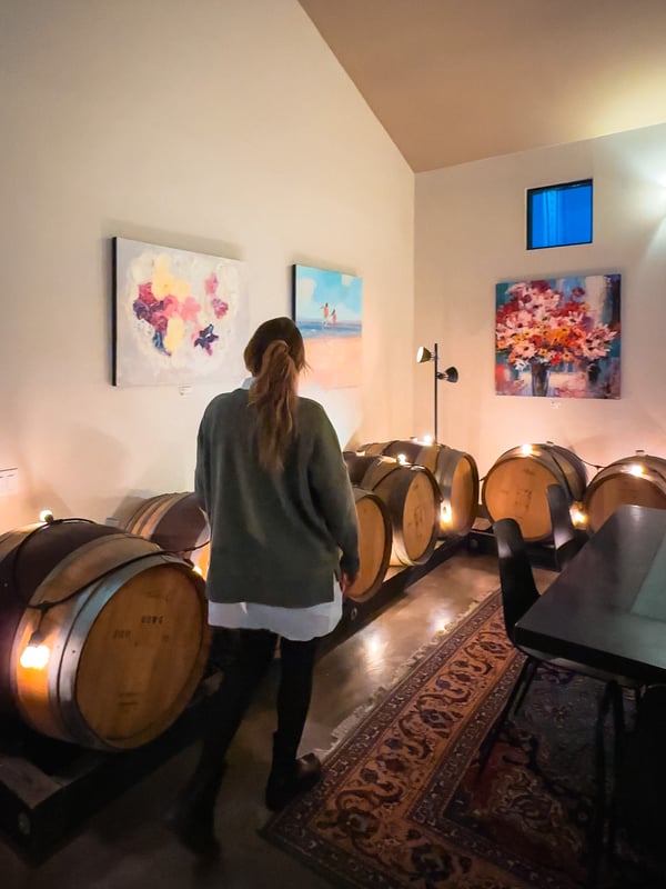 Woman walks through a winery
