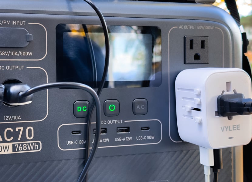 Close up of two adapters plugged into the Bluetti AC70 power station.