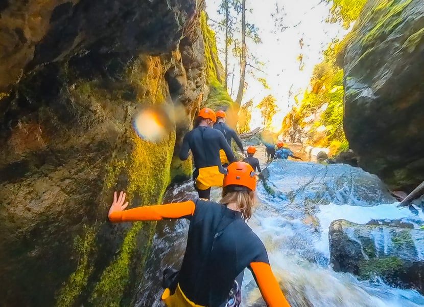A group walks through a canyon in Kelowna