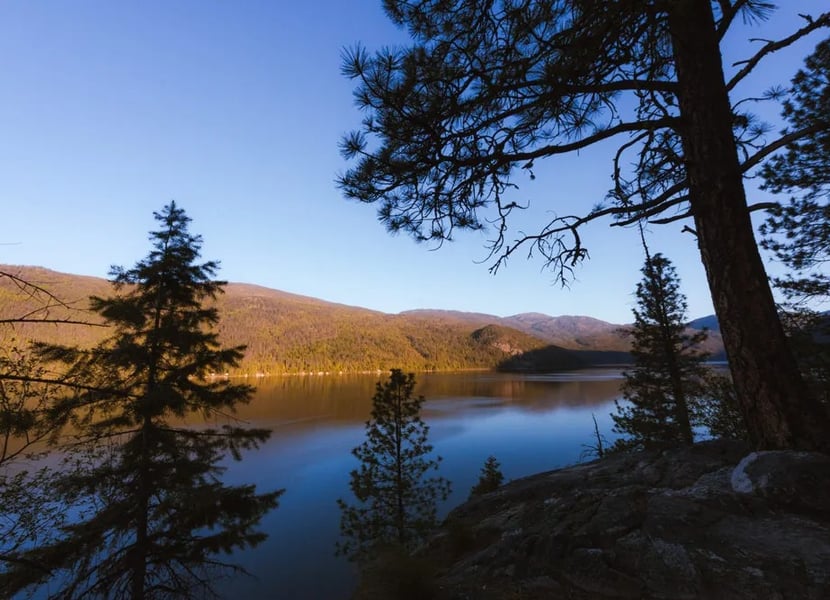 Sunrise over Christina lake from hiking trails at Texas Creek campground