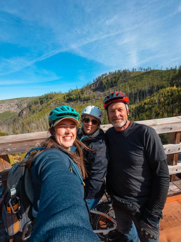 Selfie of three people riding bikes at Myra Canyon in Kelowna.