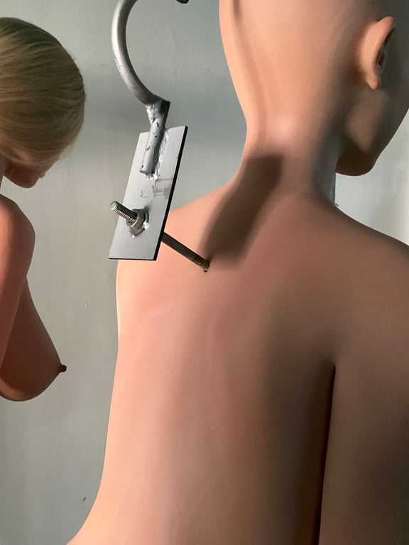 An aerial view of a field. A road runs through the upper right corner.