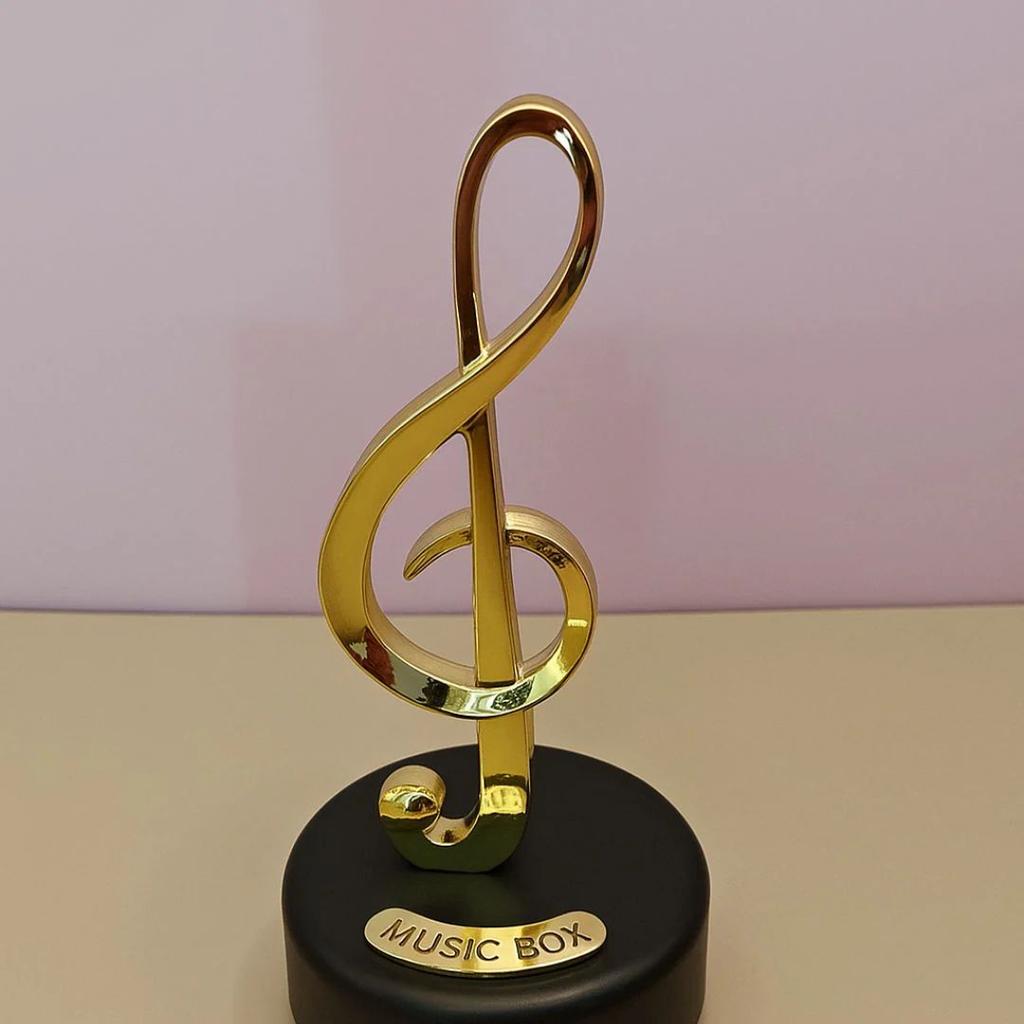 Musical Notes Wind-Up Music Box – Golden Rotating Melody Showpiece for Music Lovers — Treble Clef Music Box