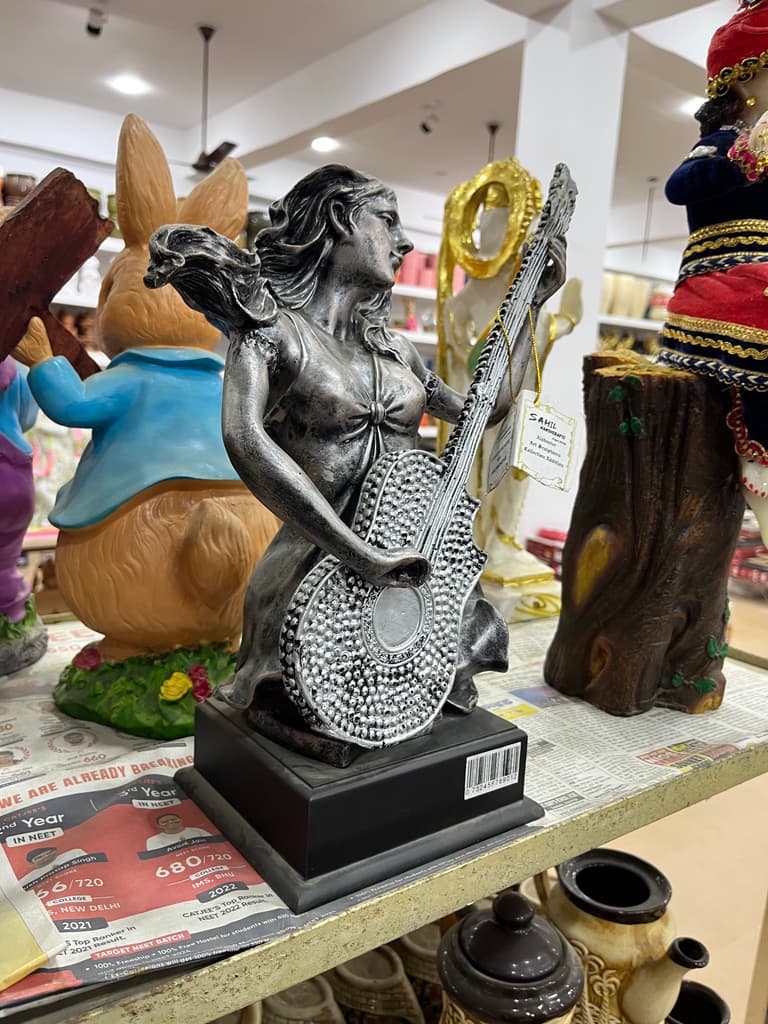Statue of a Woman Playing Guitar | Sculpture | Bronze | Brown