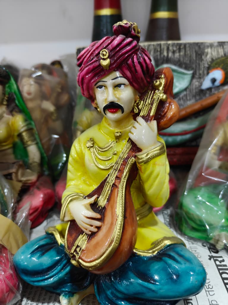 Yellow Statue of Man Playing Sitar | Musical Instrument | Ceramic | Gold