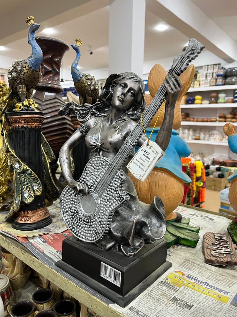 Statue of a Woman Playing Guitar | Sculpture | Bronze | Brown