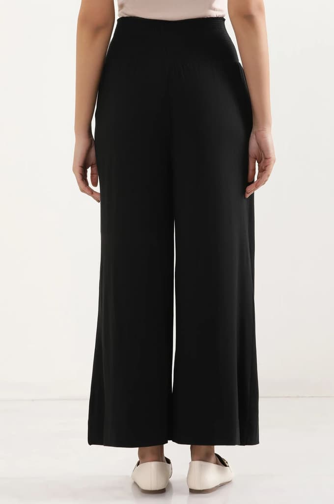 Black Solid Flared Pants With Smocked Waistbelt — photo 4