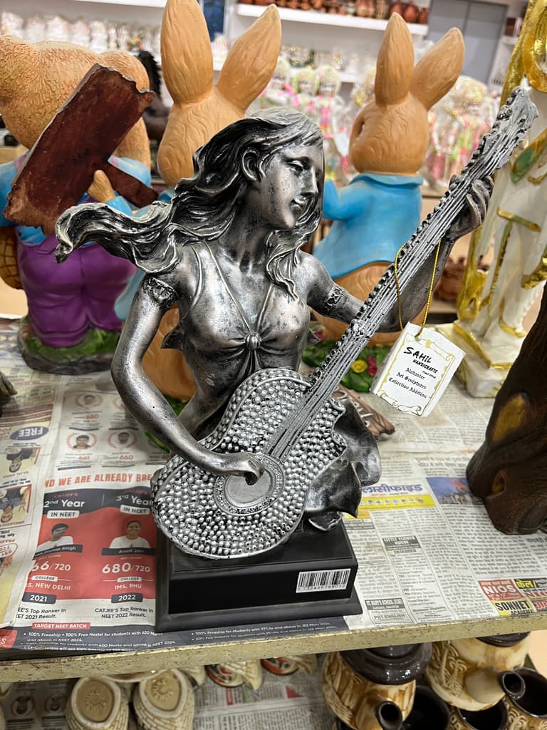 Statue of a Woman Playing Guitar | Sculpture | Bronze | Brown