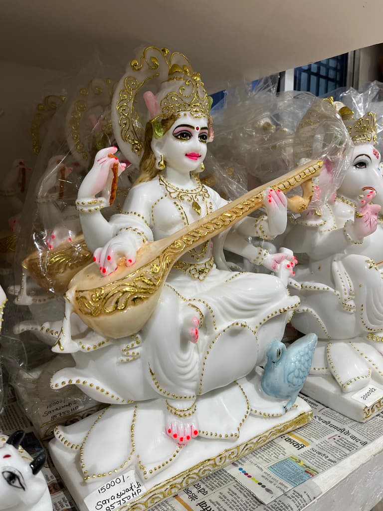 White Statue of Woman Holding a Stick | Sculpture | Porcelain | White