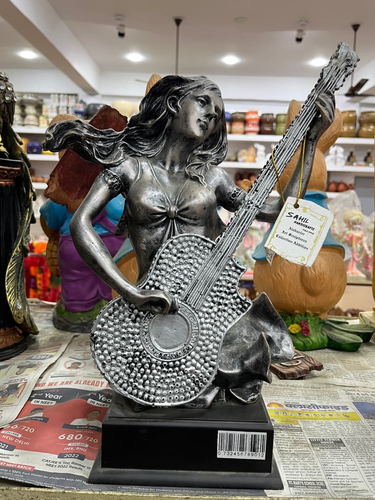 Statue of a Woman Playing Guitar | Sculpture | Bronze | Brown
