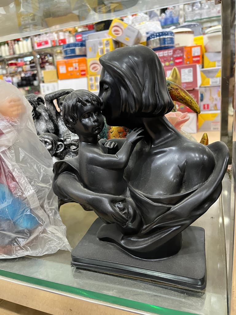 Black Statue of a Woman Holding a Baby | Sculpture | Bronze | Black