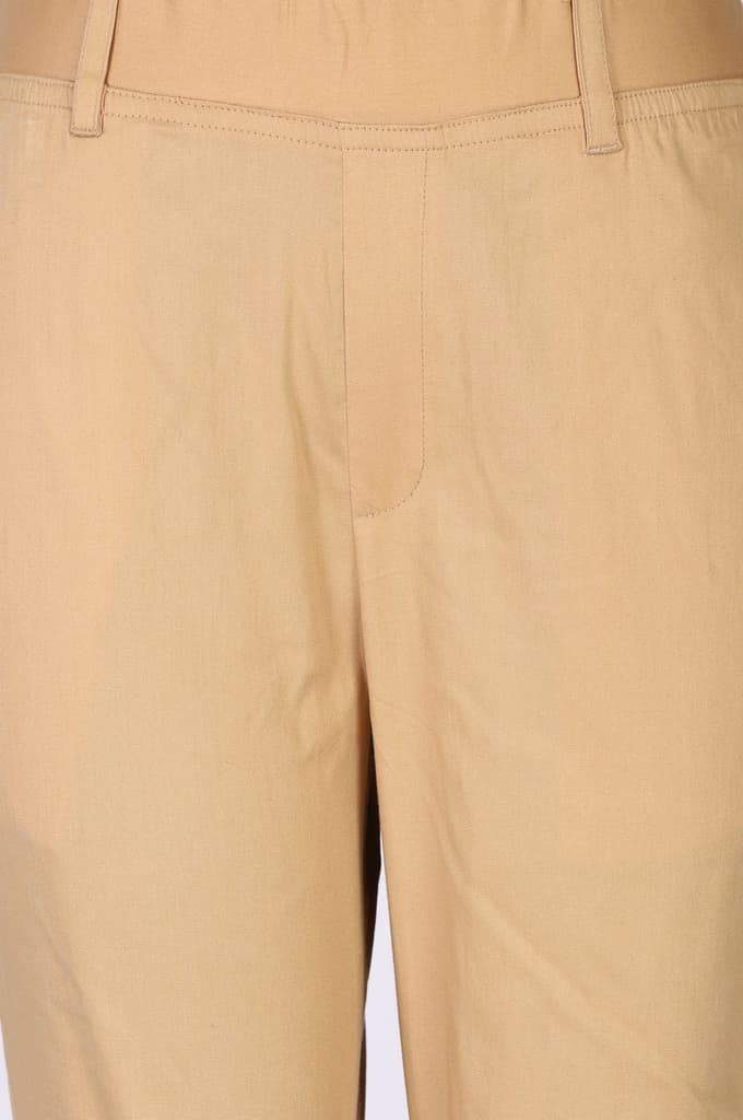Light Gold Solid Cotton Blend Tapered Fit Ankle Length Trousers — photo 6