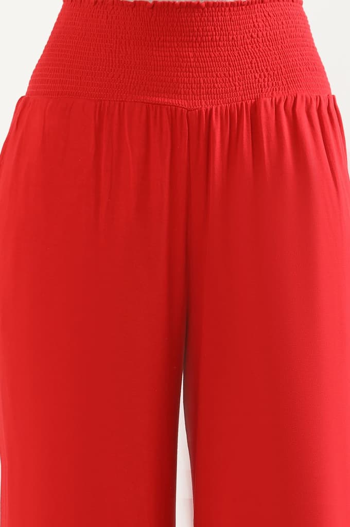 Red Solid Flared Pants With Smocked Waistbelt — photo 6