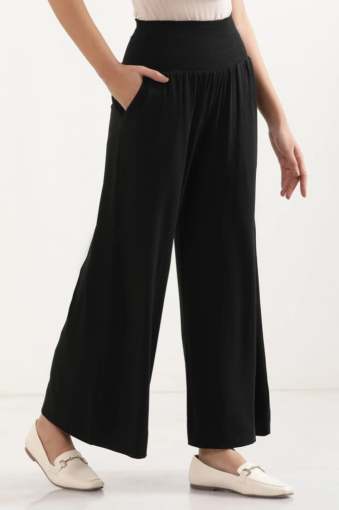 Black Solid Flared Pants With Smocked Waistbelt — photo 5