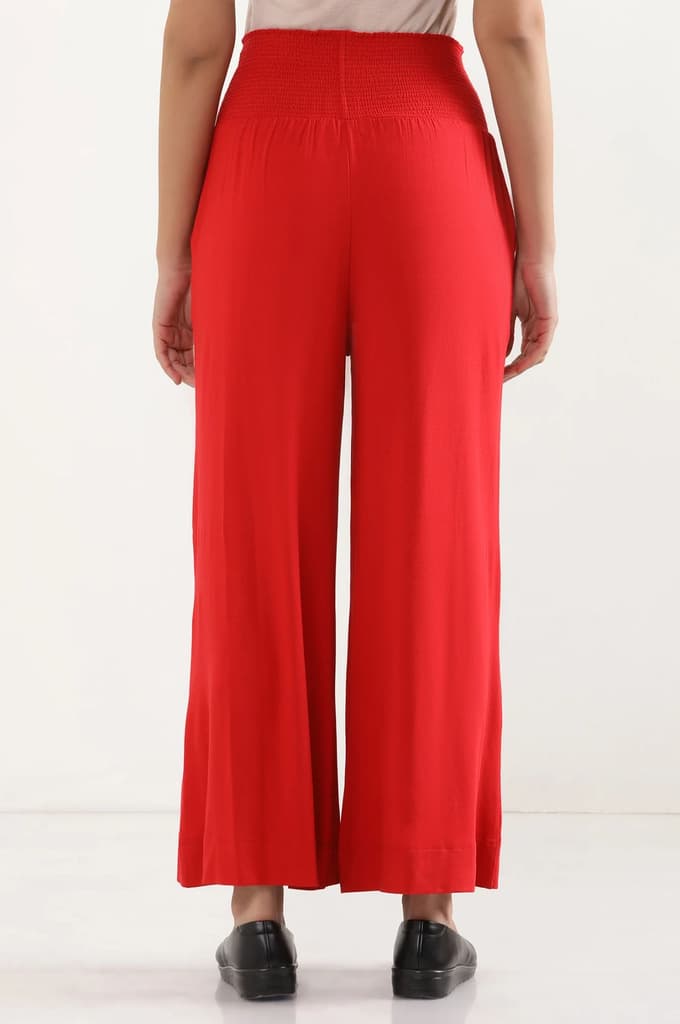 Red Solid Flared Pants With Smocked Waistbelt — photo 4
