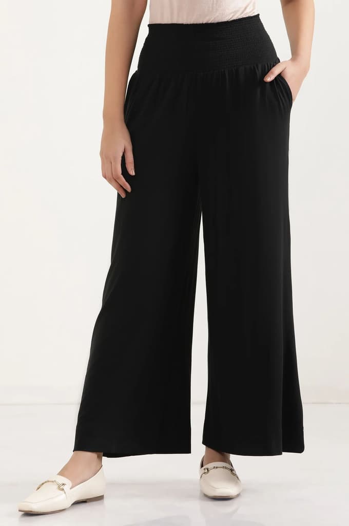 Black Solid Flared Pants With Smocked Waistbelt — photo 2