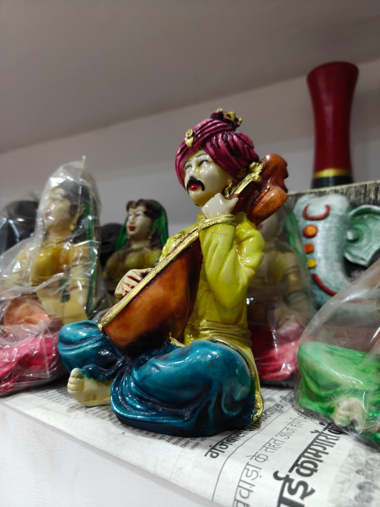 Yellow Statue of Man Playing Sitar | Musical Instrument | Ceramic | Gold