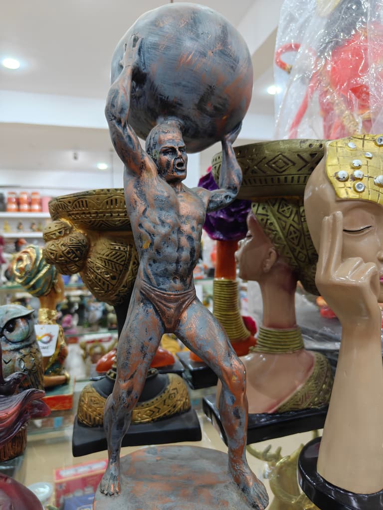 Bronze Statue of a Man Holding a Ball | Sculpture | Bronze | Gold