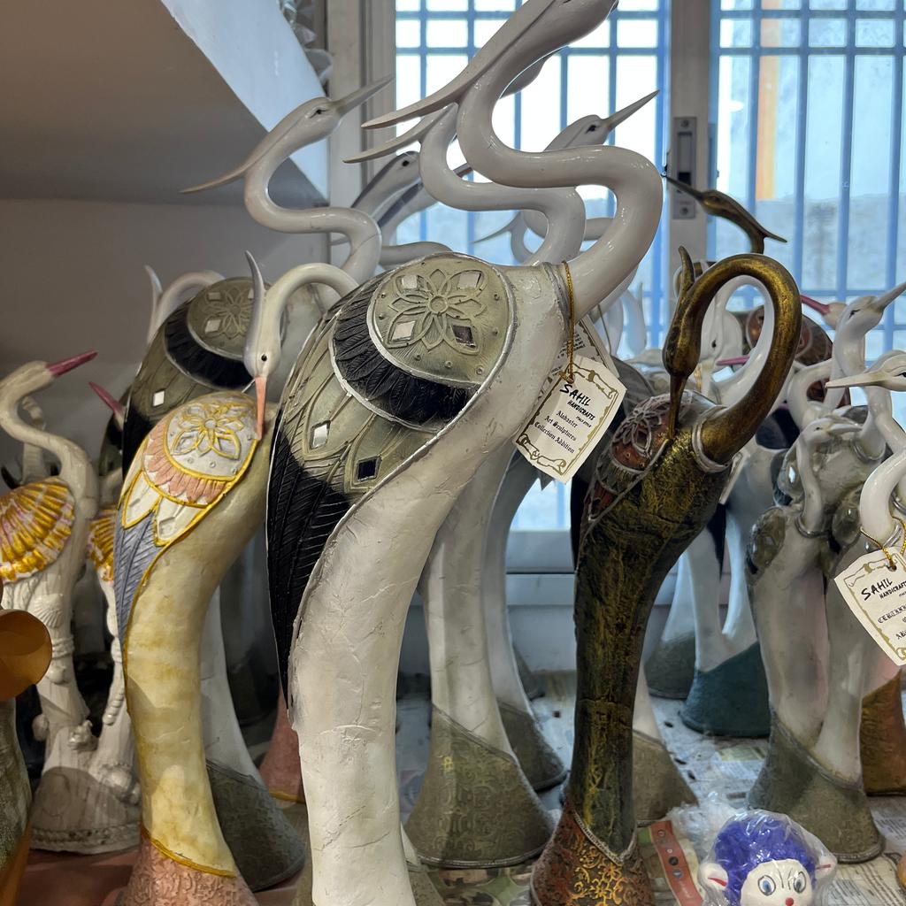 A collection of various animal statues, including a | Unknown | Unknown