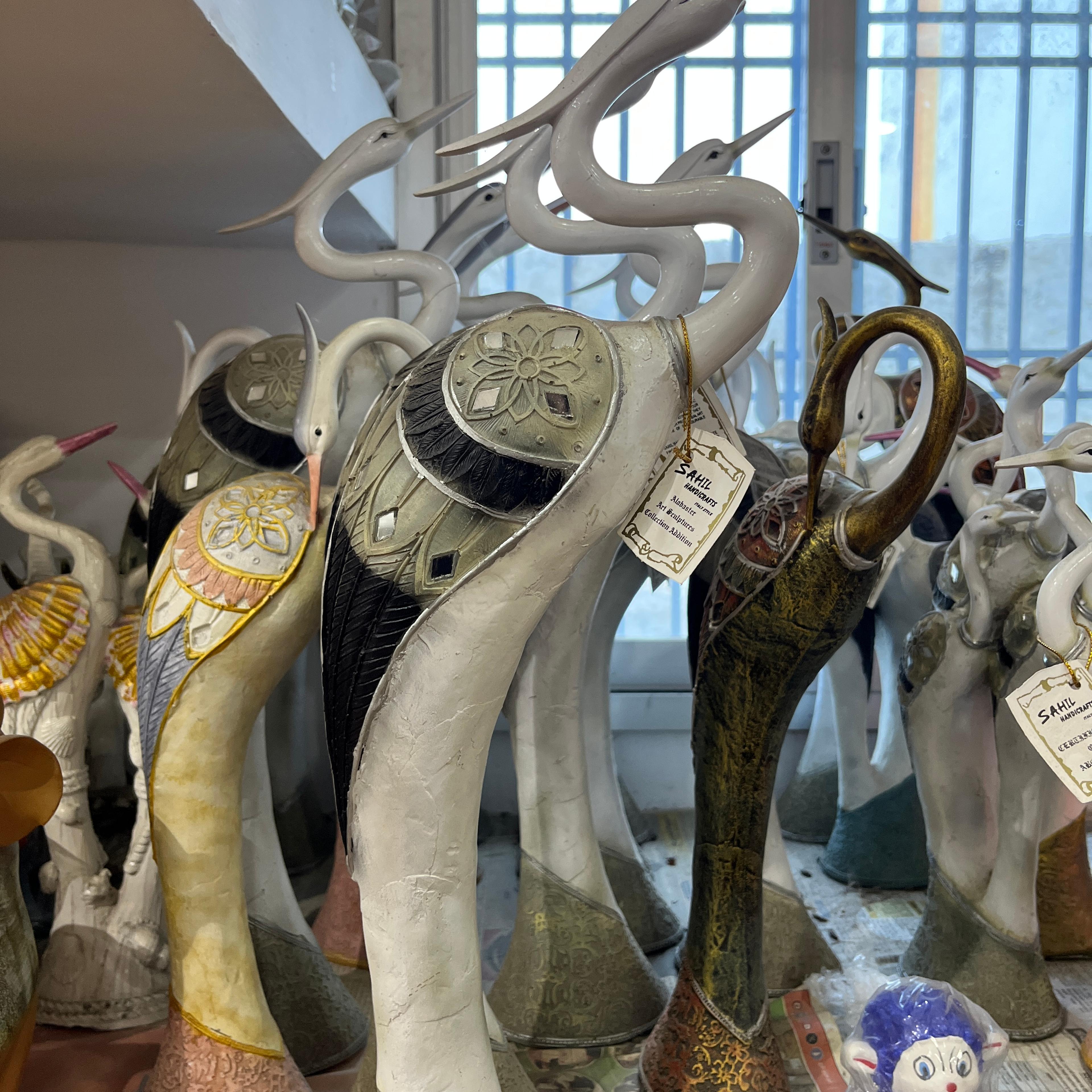 A collection of various animal statues, including a | Unknown | Unknown