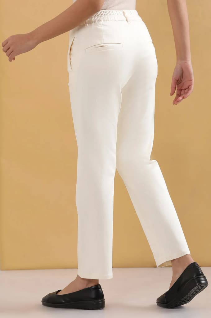 Off White Solid Straight Fit Cotton Pants With Pintuck Detail — photo 4