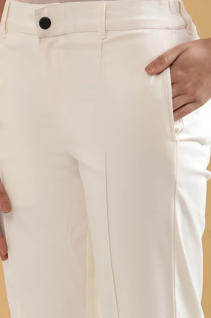 Off White Solid Straight Fit Cotton Pants With Pintuck Detail — photo 7