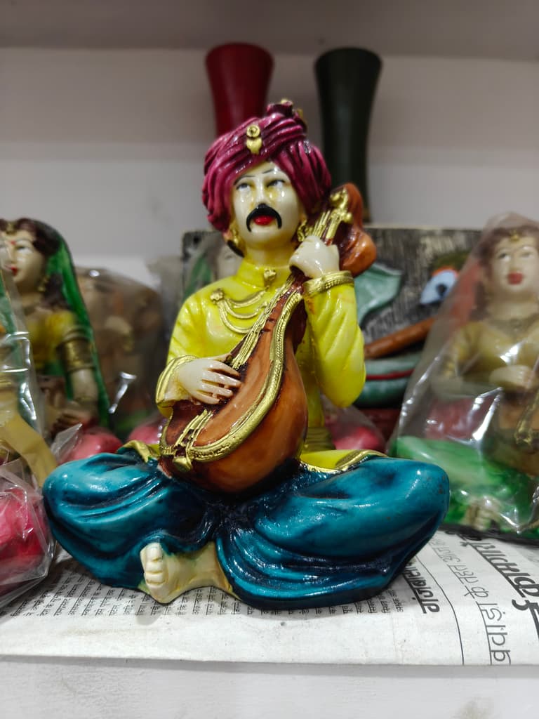 Yellow Statue of Man Playing Sitar | Musical Instrument | Ceramic | Gold