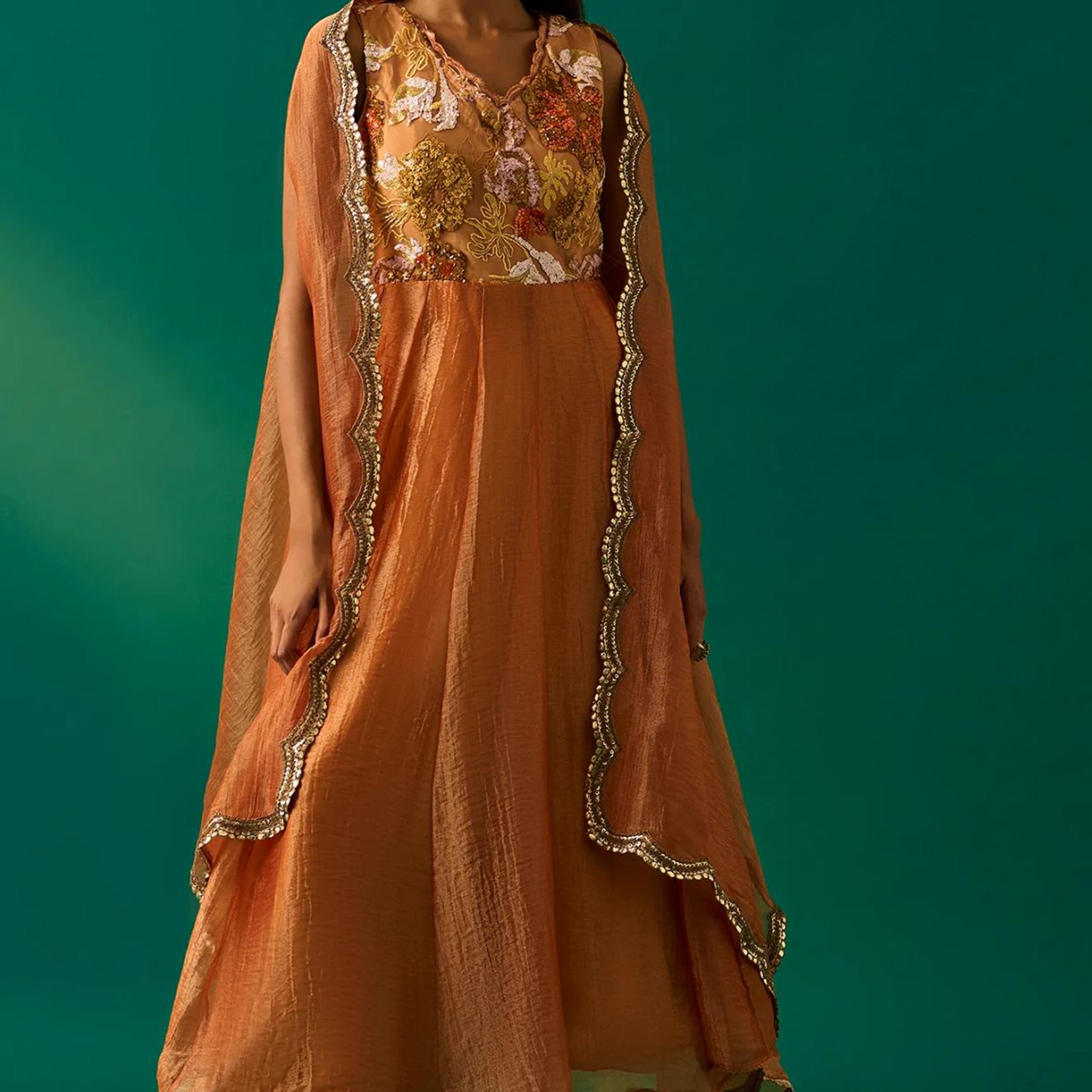 Orange Embroidered Flared Net Dress with Churidar and Cape Set
