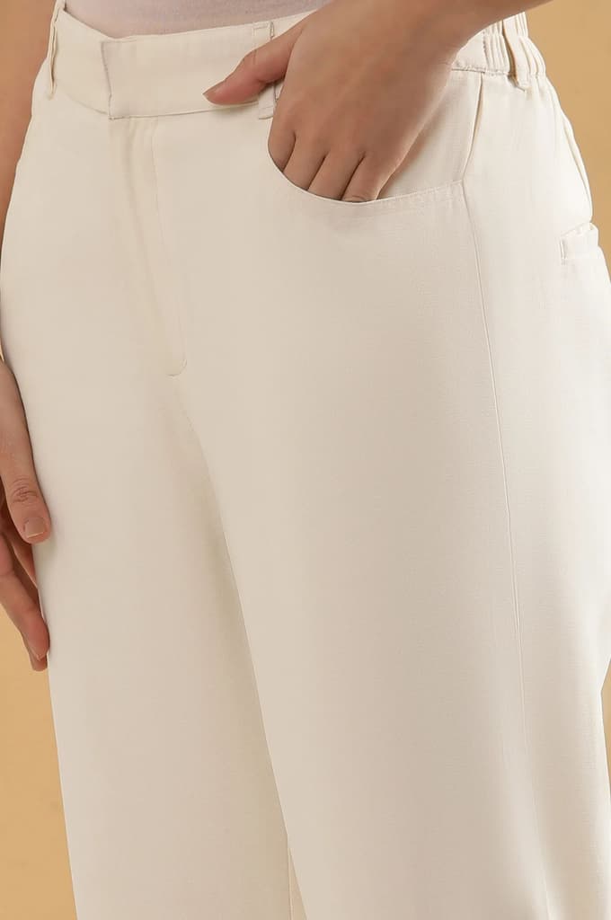Off White Solid Straight Fit Rayon Pants With Belt Loops — photo 7