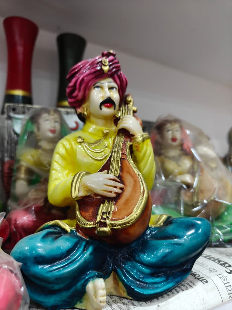 Yellow Statue of Man Playing Sitar | Musical Instrument | Ceramic | Gold