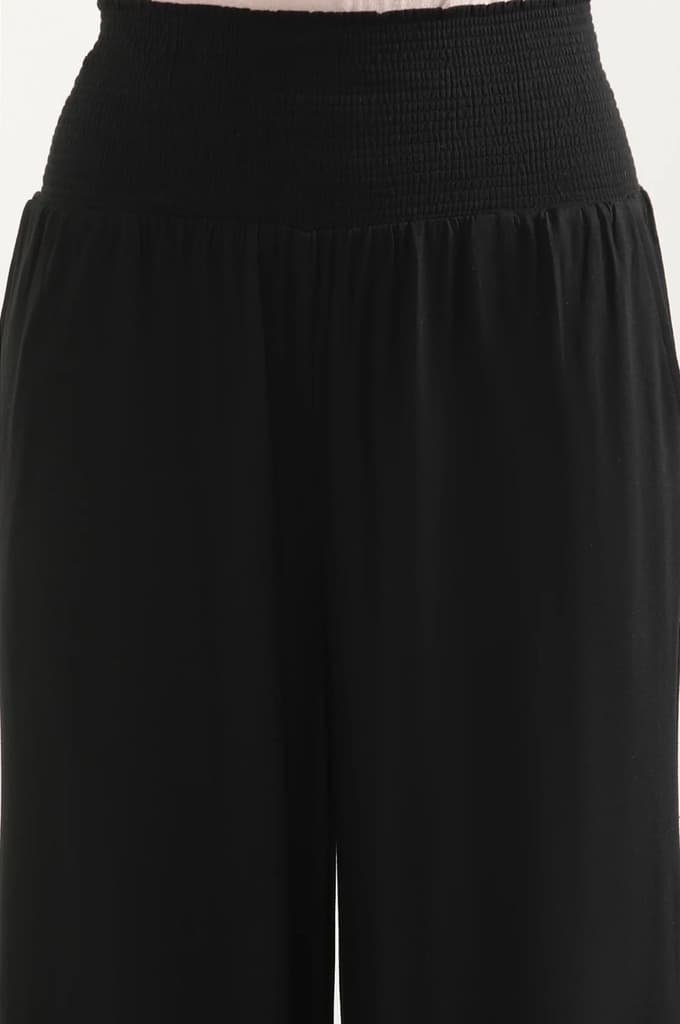 Black Solid Flared Pants With Smocked Waistbelt — photo 6