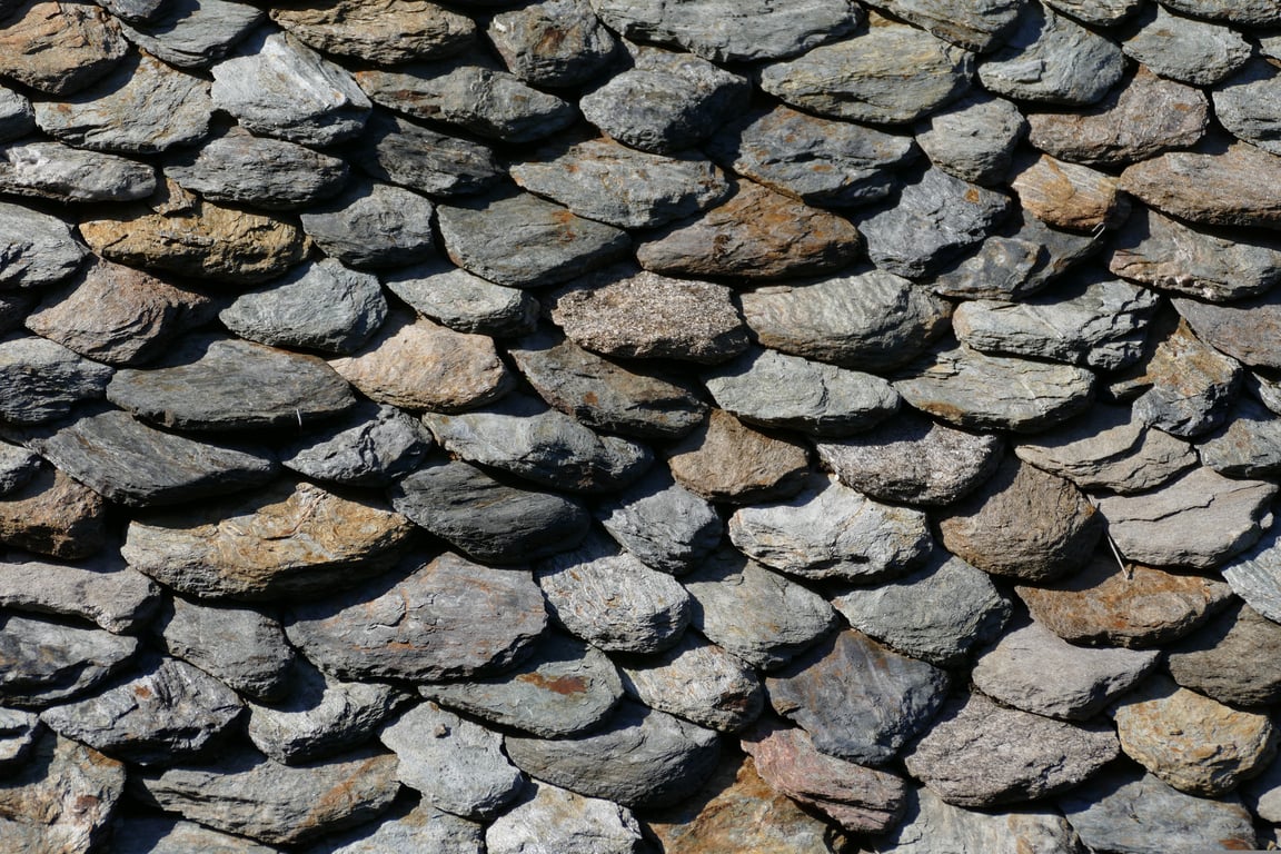 roofing contractor inspecting roof