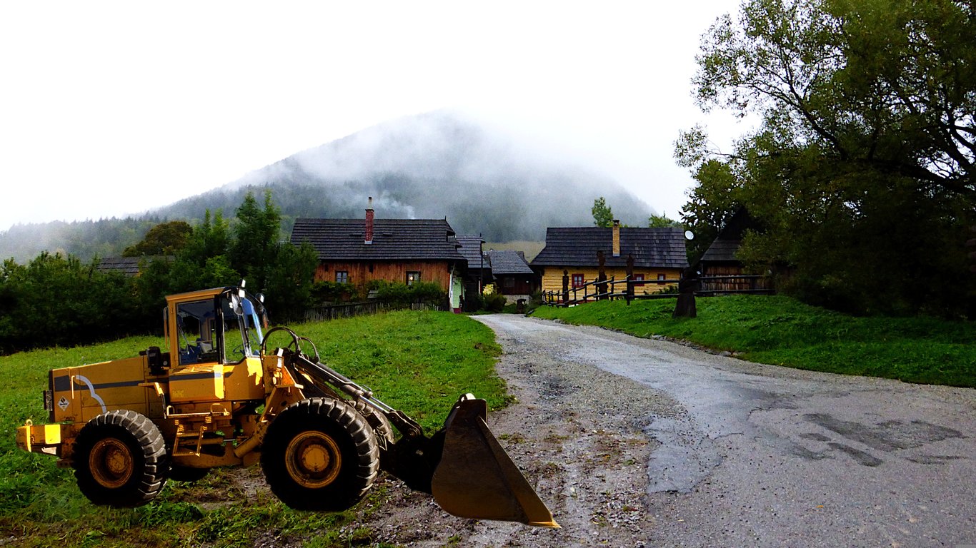 backhoe loader digging trench