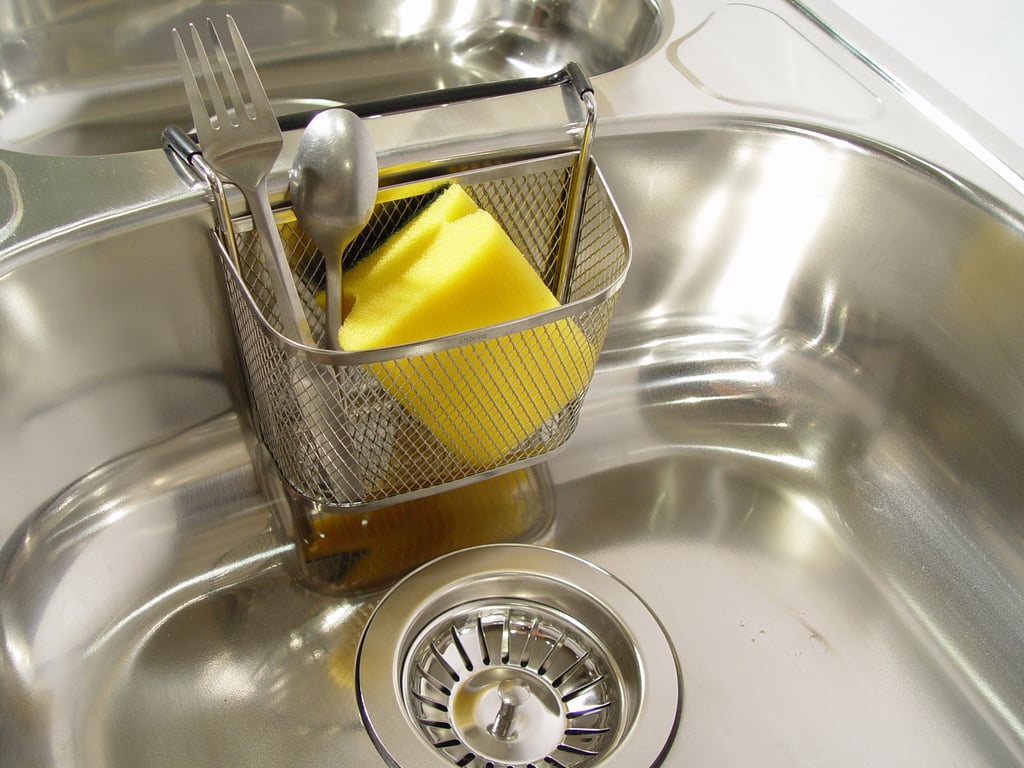 plumber inspecting kitchen sink
