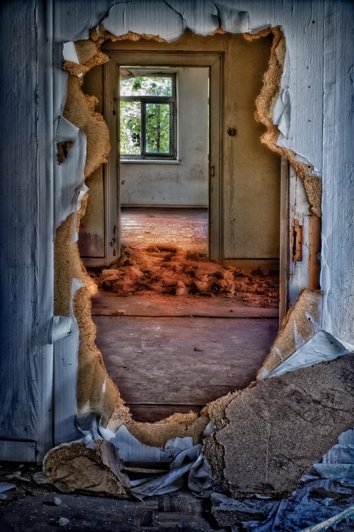 plastic-covered broken window