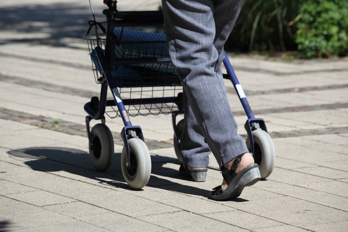 senior using walker at home