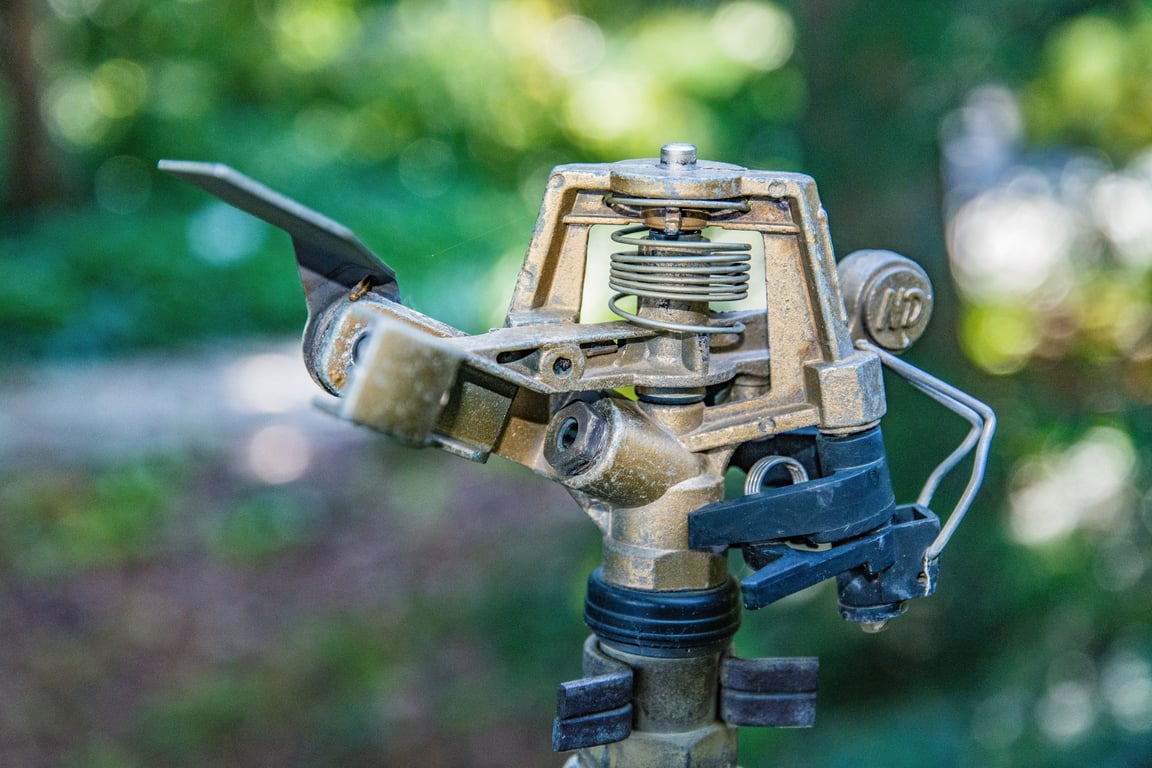 broken lawn sprinkler head