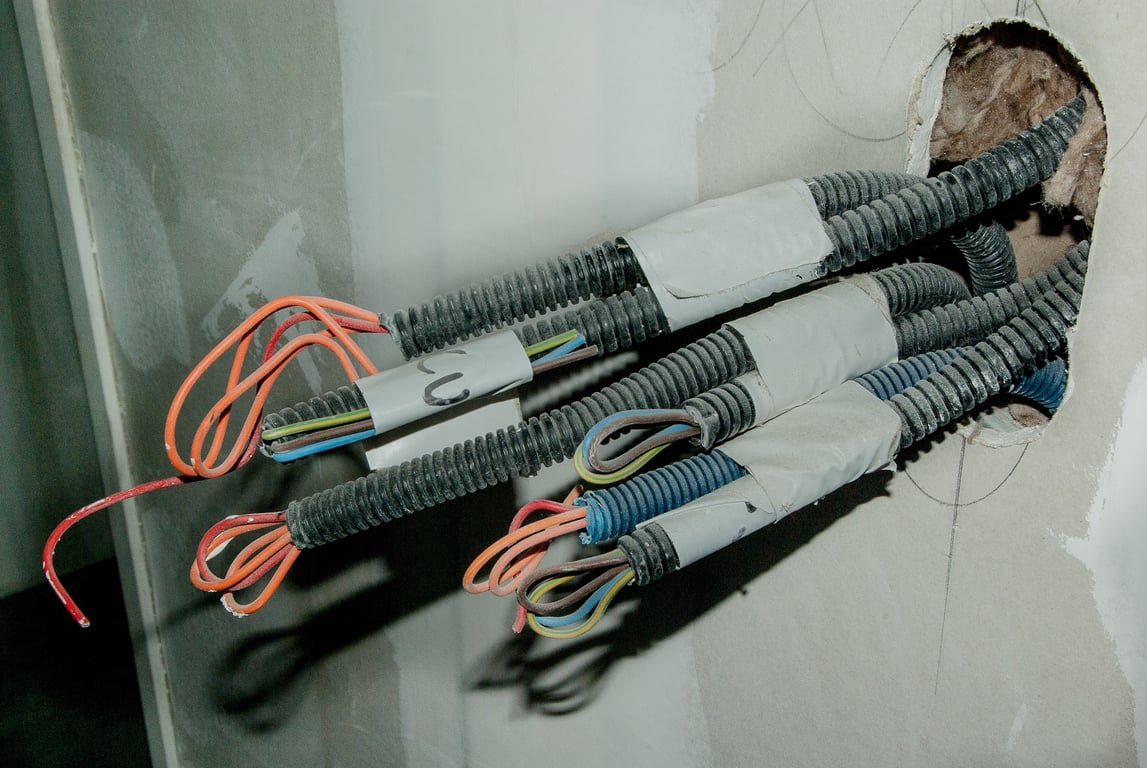 electrician inspecting home electrical panel