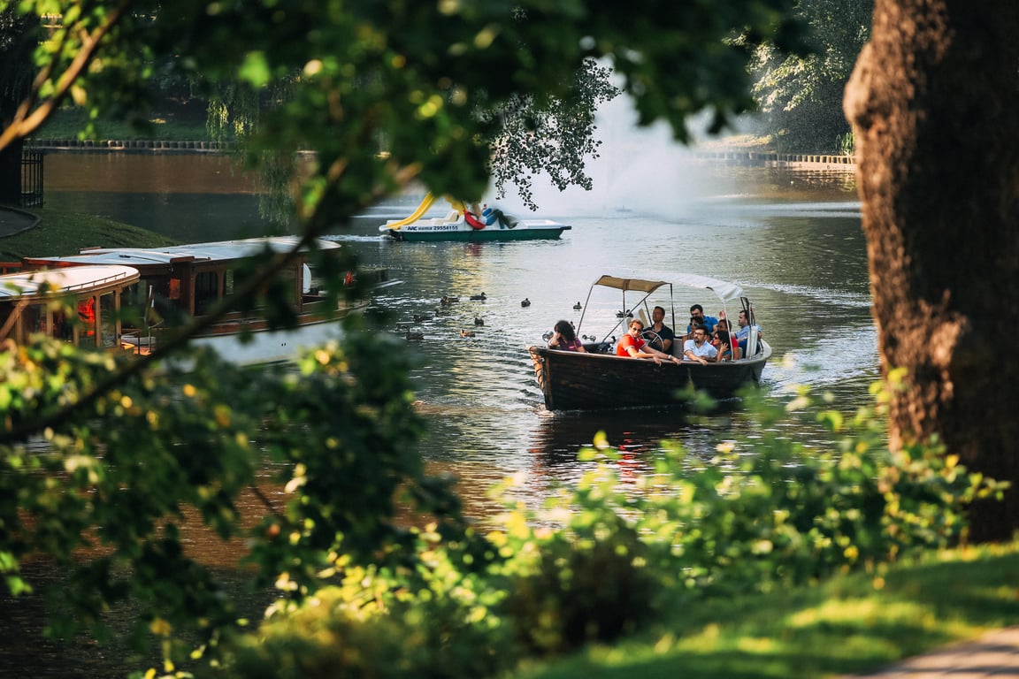 family pontoon boat on lake