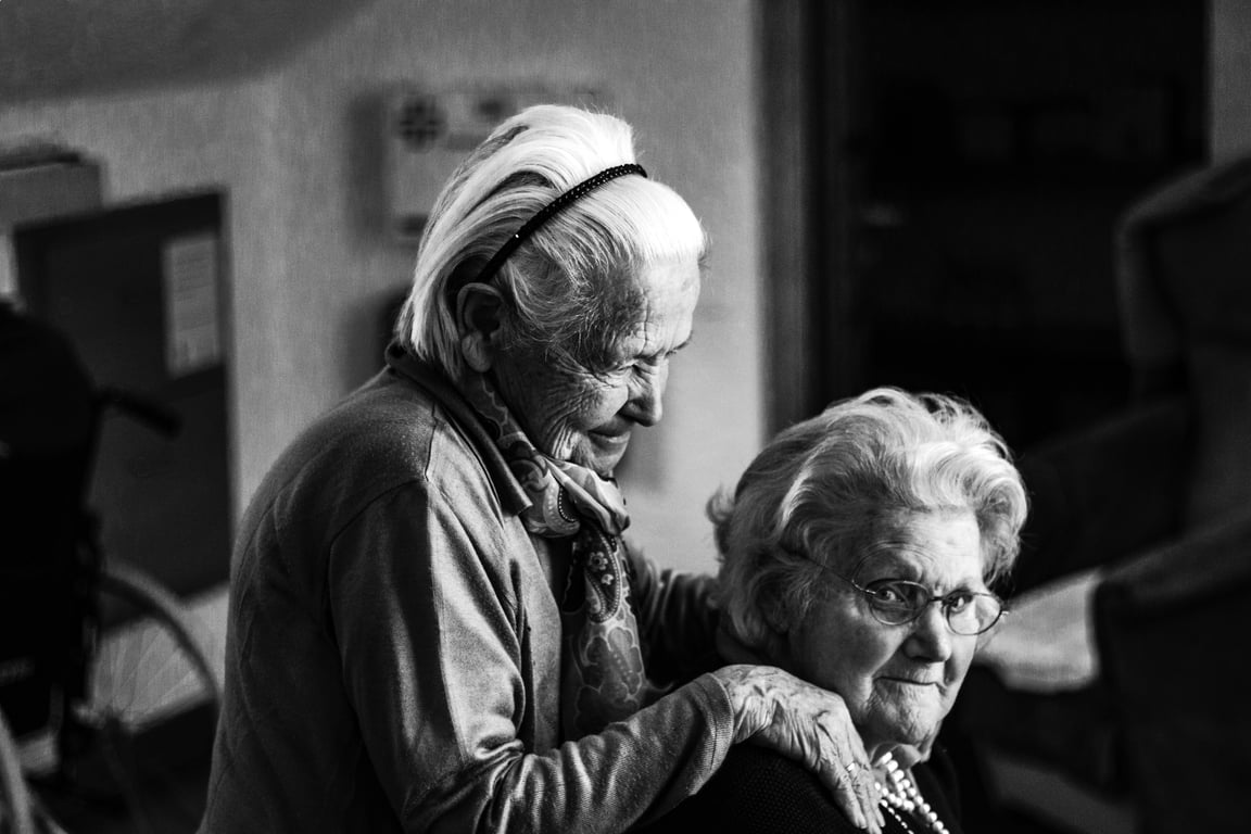 in-home caregiver assisting senior