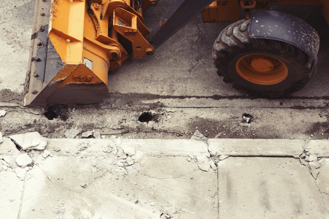 hydraulic excavator loading dump trucks