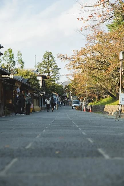 "Couple celebrating in front of their new home, illustrating successful saving from the 'Top 7 Ways to Save for a House Now 2025 Guide!'"