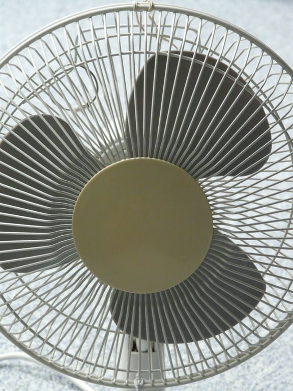 HVAC technician inspecting air conditioner