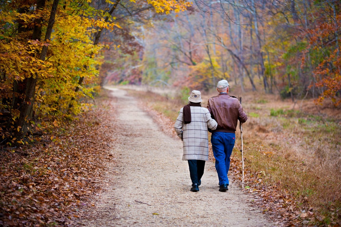 senior couple walking neighborhood