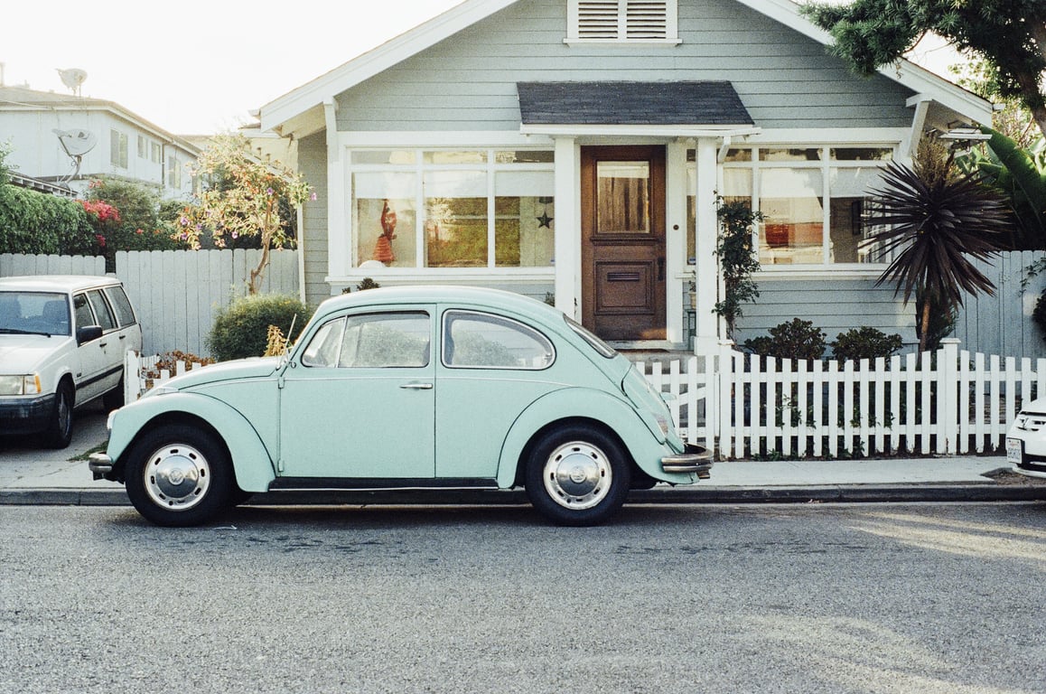 mobile mechanic repairing car driveway
