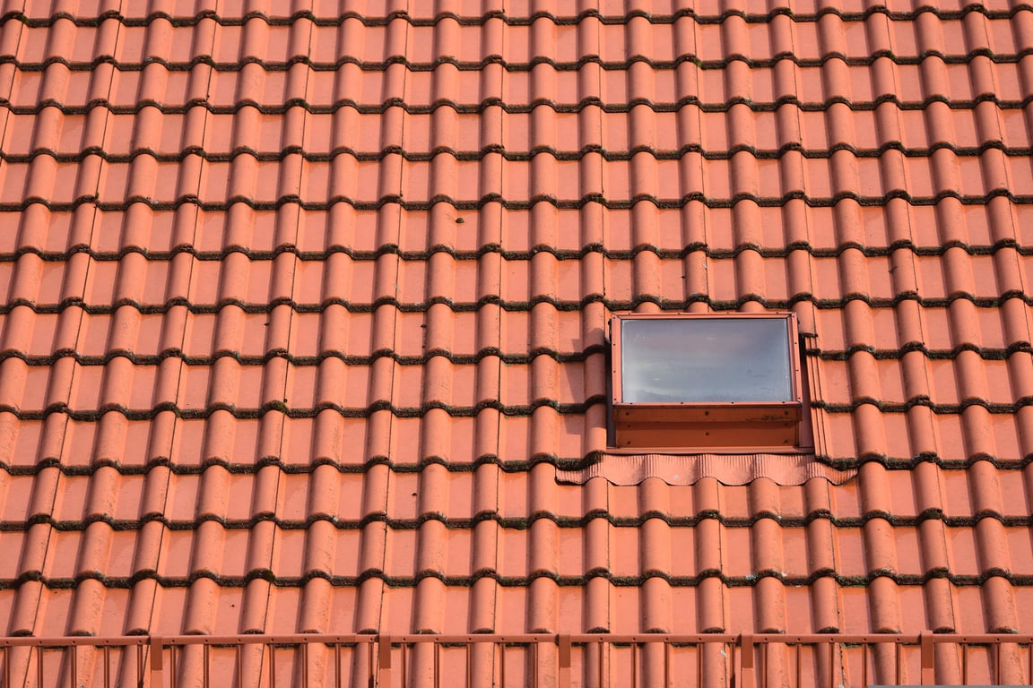 roofing contractor inspecting roof
